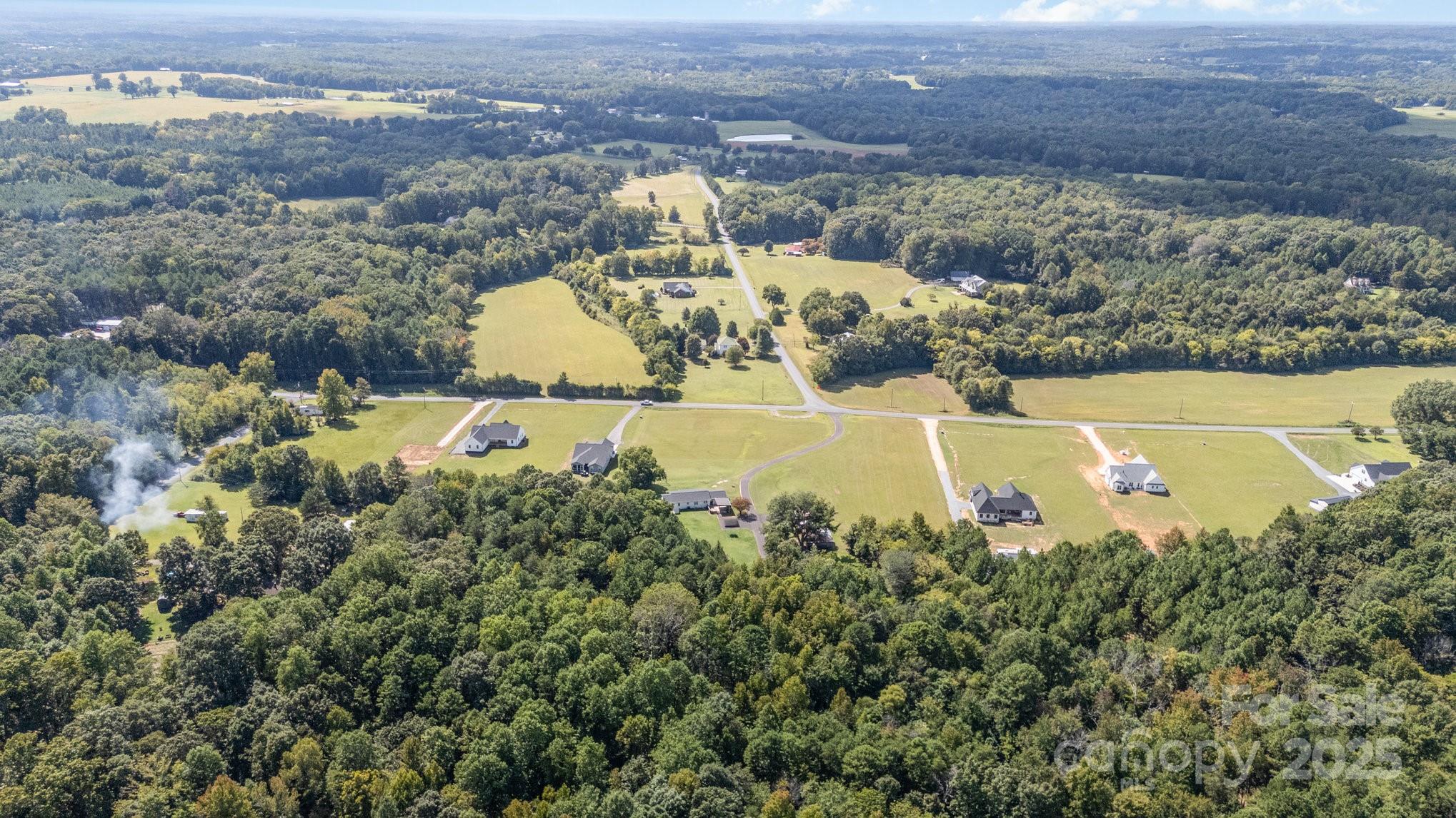 2295 Emanuel Church Road Rockwell, NC 28138 - Photo 33 of 33 an aerial view of a house with a yard lake lake and mountain view