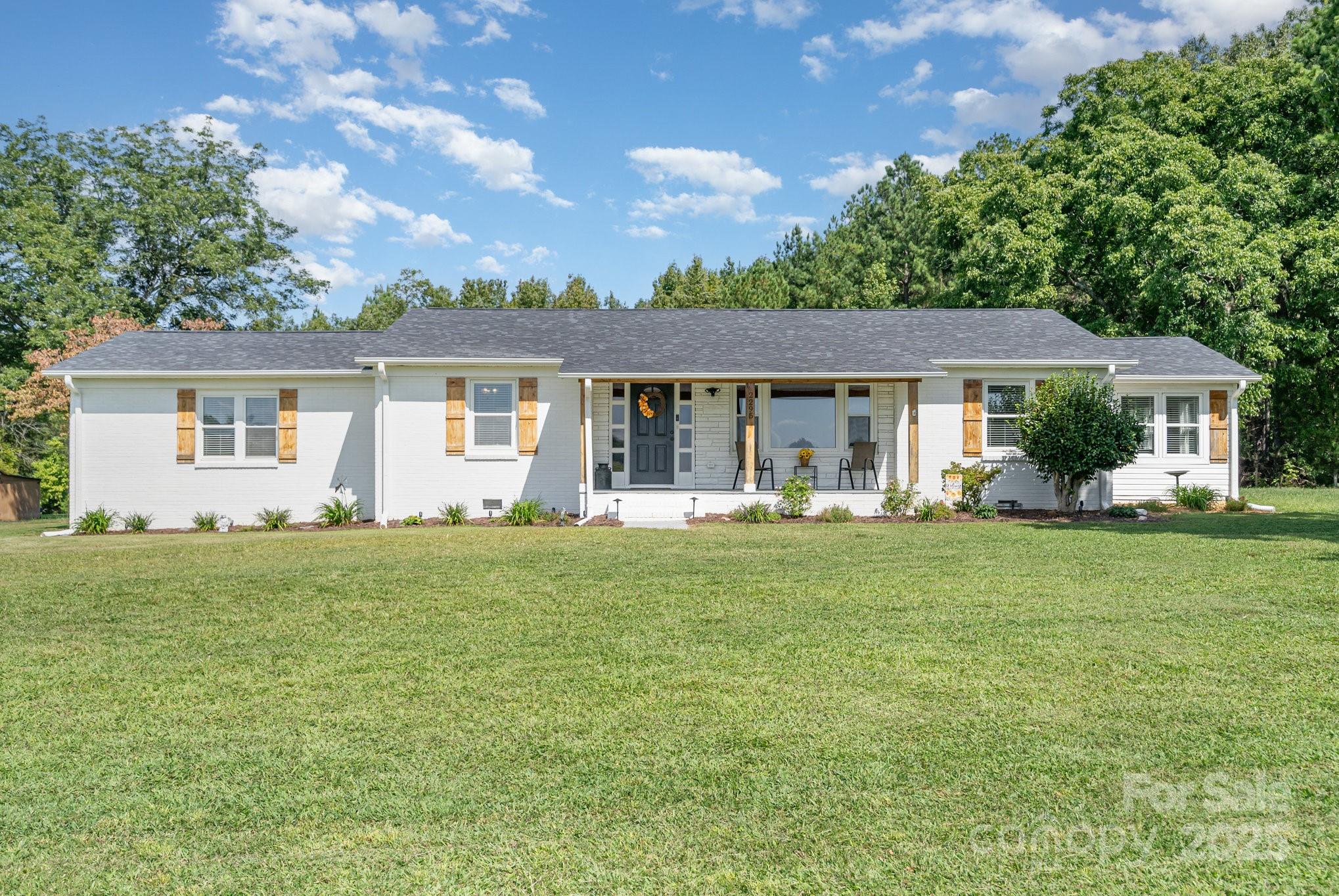 2295 Emanuel Church Road Rockwell, NC 28138 - Photo 4 of 33 a front view of house with yard and green space