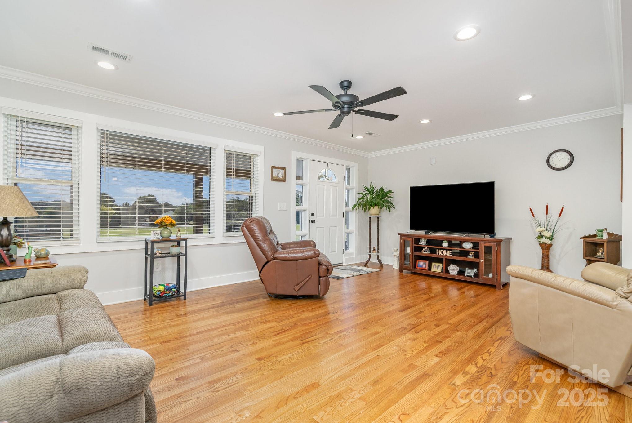 2295 Emanuel Church Road Rockwell, NC 28138 - Photo 6 of 33 a living room with furniture and a flat screen tv