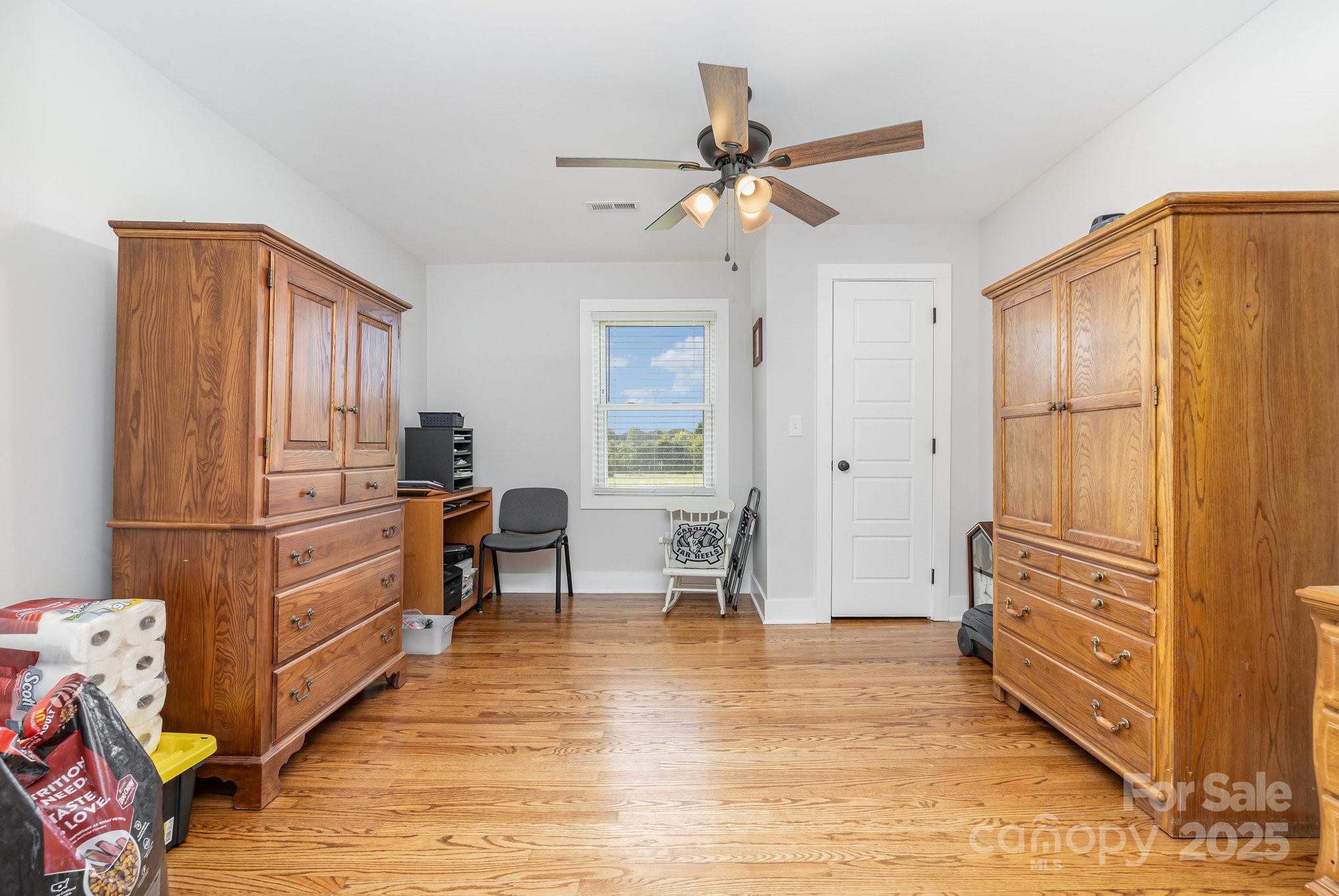 2295 Emanuel Church Road Rockwell, NC 28138 - Photo 9 of 33 a kitchen with granite countertop a refrigerator stove and wooden floor