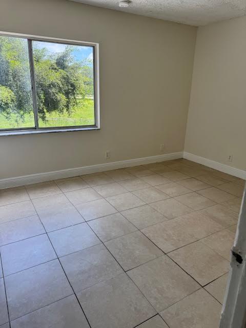 537 Northwest 46th Avenue Delray Beach, FL 33445 - Photo 14 of 20 a view of a room with a window
