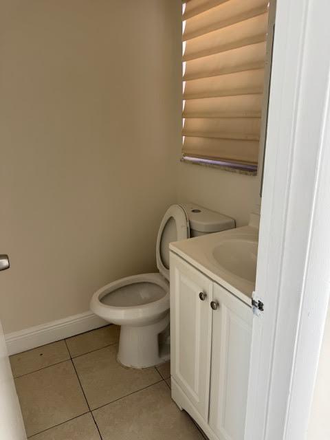537 Northwest 46th Avenue Delray Beach, FL 33445 - Photo 6 of 20 a bathroom with a toilet and a sink