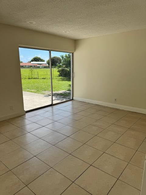 537 Northwest 46th Avenue Delray Beach, FL 33445 - Photo 7 of 20 a view of an empty room and a window