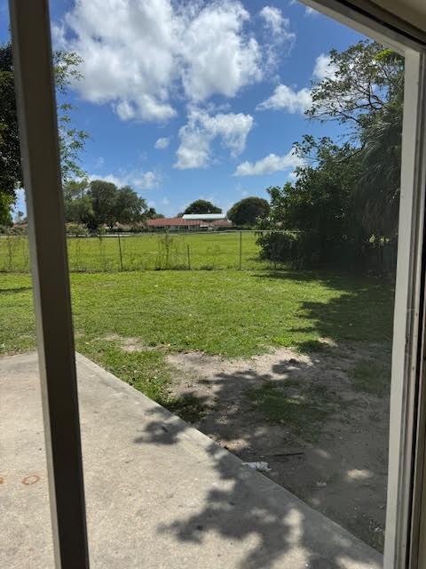 537 Northwest 46th Avenue Delray Beach, FL 33445 - Photo 9 of 20 a view of a big yard with potted plants