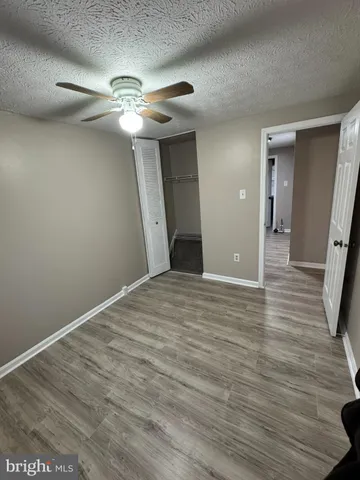 a view of a livingroom with wooden floor