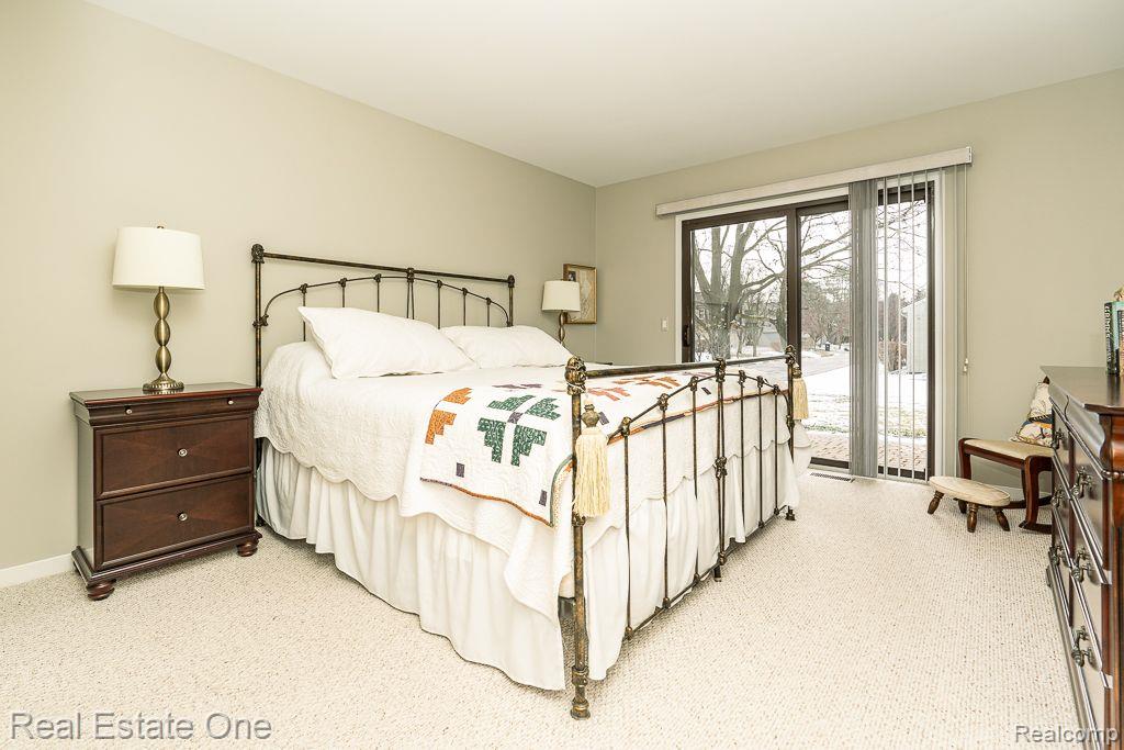 641 Ashley Circle East Rochester, MI 48307 - Photo 9 of 22 Primary bedroom 1 of 2 with door wall to patio