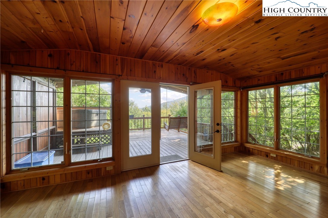 280 Chinkapin Ridge Road Seven Devils, NC 28604 - Photo 11 of 36 a view of room with wooden floor and balcony