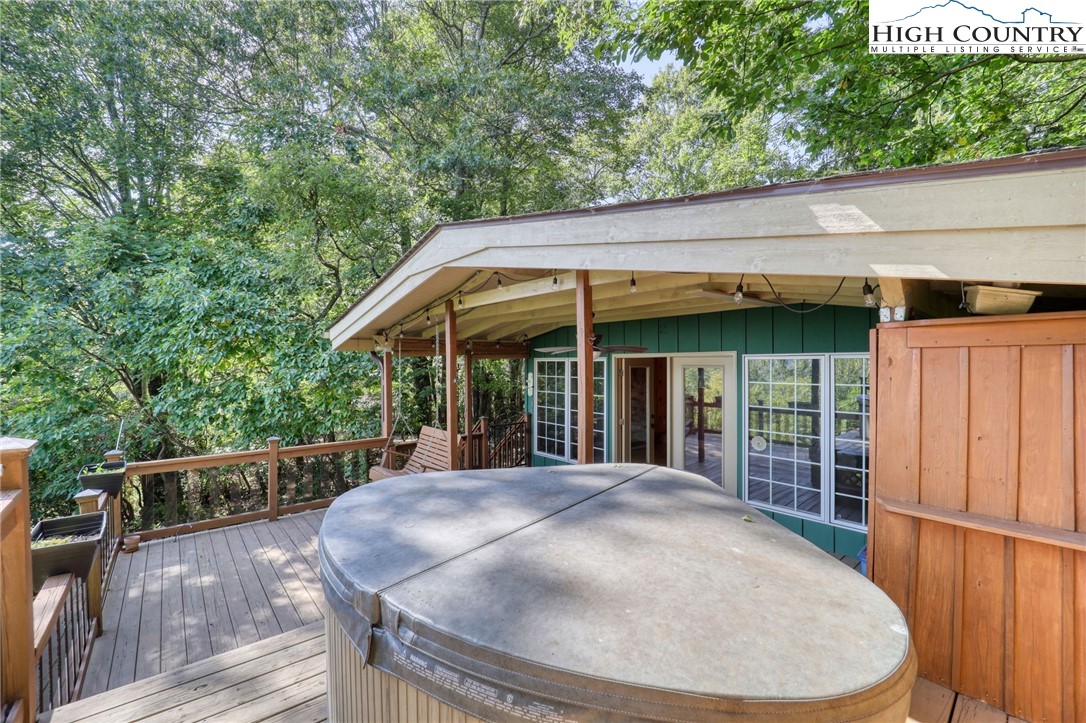 280 Chinkapin Ridge Road Seven Devils, NC 28604 - Photo 21 of 36 a view of a roof deck with wooden floor and fence