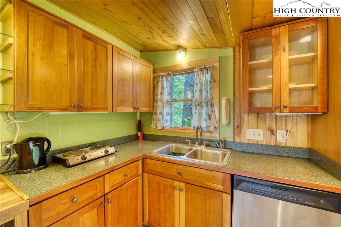 280 Chinkapin Ridge Road Seven Devils, NC 28604 - Photo 22 of 36 a kitchen with a sink and a window