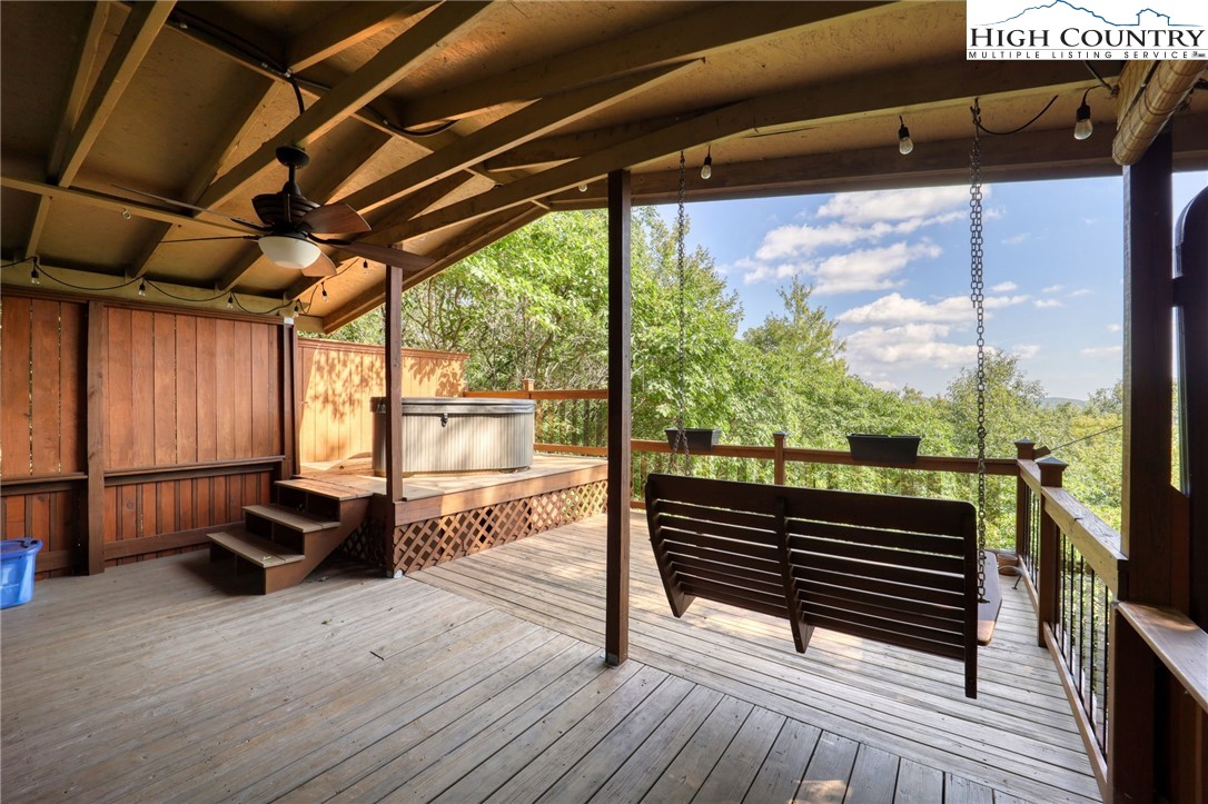 280 Chinkapin Ridge Road Seven Devils, NC 28604 - Photo 33 of 36 a view of a porch with furniture and a yard