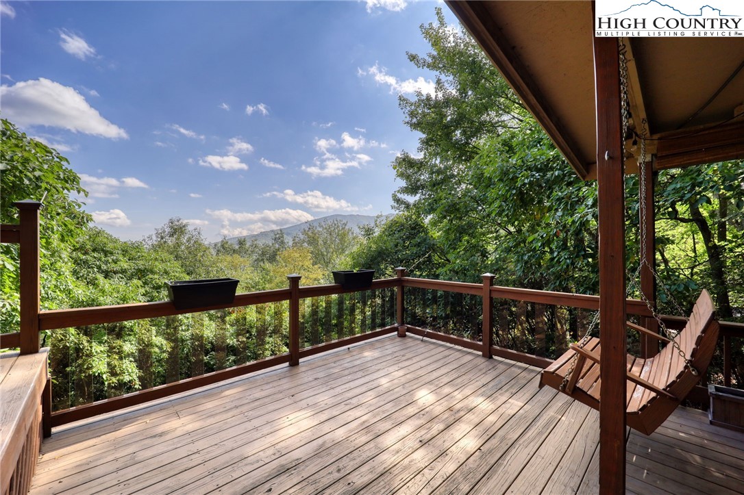 280 Chinkapin Ridge Road Seven Devils, NC 28604 - Photo 35 of 36 a view of balcony with wooden floor and seating
