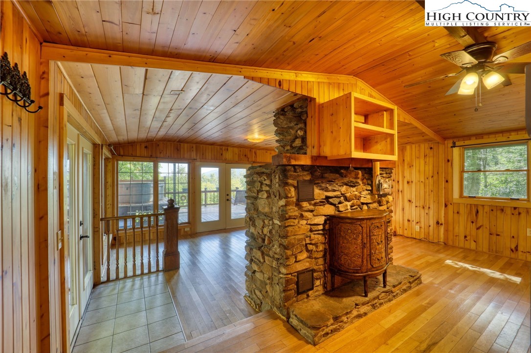 280 Chinkapin Ridge Road Seven Devils, NC 28604 - Photo 10 of 36 a view of a fireplace with wooden floor