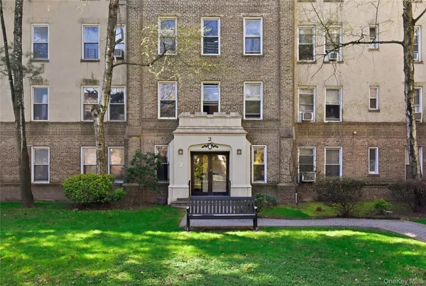 a large building with a yard in front of it