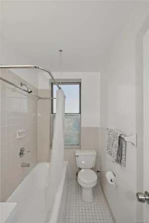 a bathroom with a toilet sink a shower and bathtub