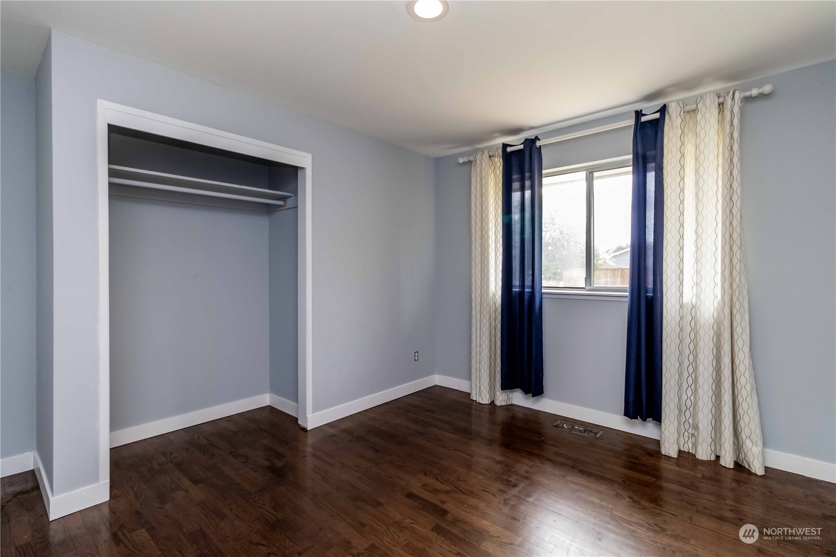 3816 Northeast 12th Street Renton, WA 98056 - Photo 25 of 39 a view of an empty room with wooden floor and a window