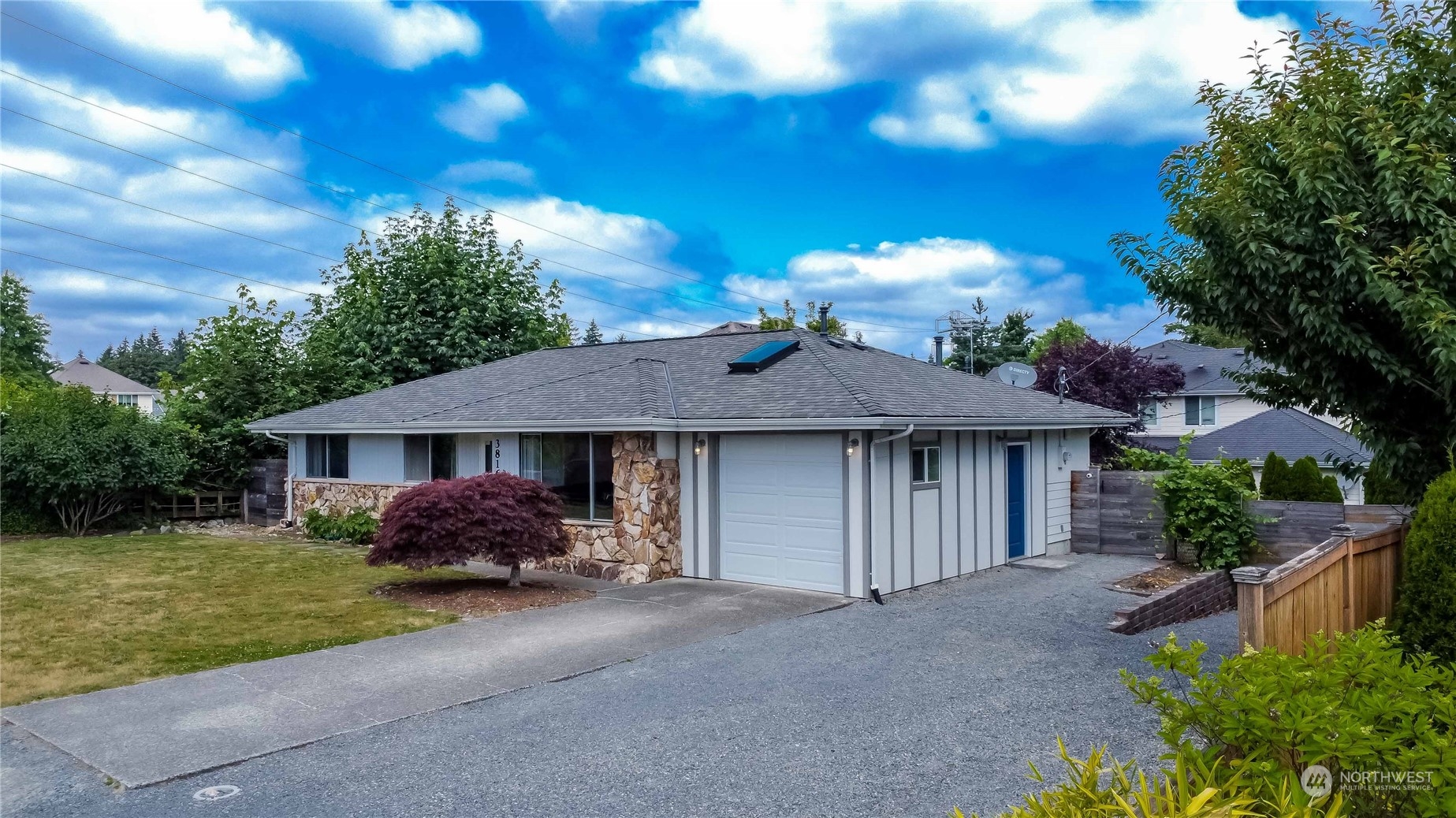 3816 Northeast 12th Street Renton, WA 98056 - Photo 3 of 39 a front view of a house with garden