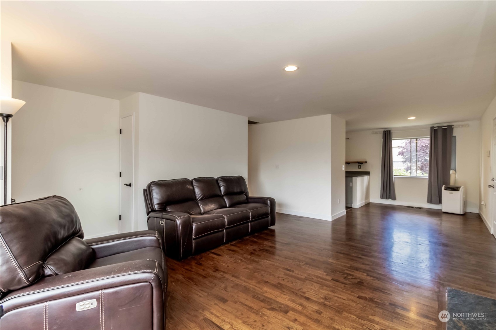 3816 Northeast 12th Street Renton, WA 98056 - Photo 6 of 39 a living room with furniture and wooden floor