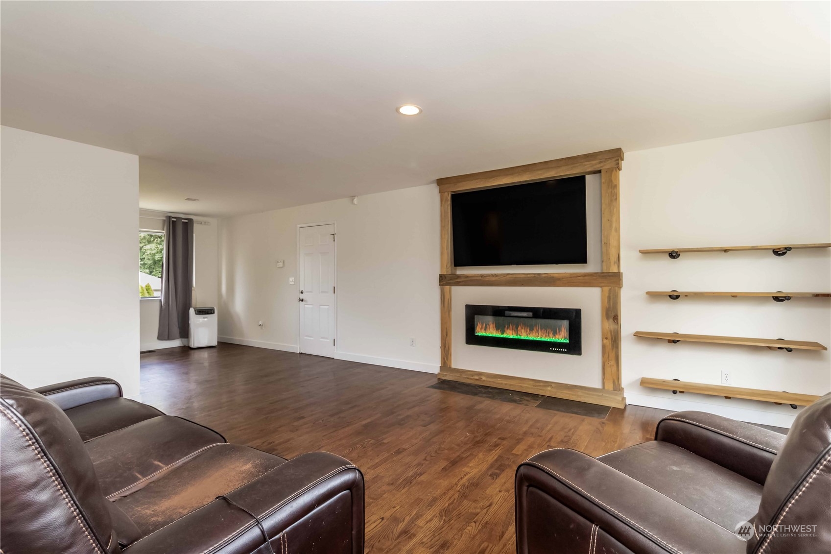 3816 Northeast 12th Street Renton, WA 98056 - Photo 8 of 39 a living room with furniture and a fireplace