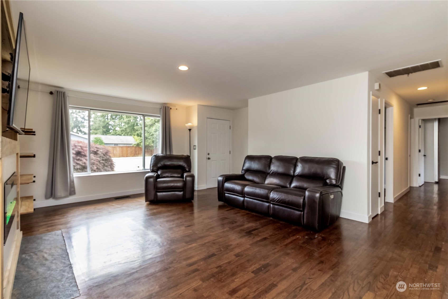 3816 Northeast 12th Street Renton, WA 98056 - Photo 9 of 39 a living room with furniture and a large window