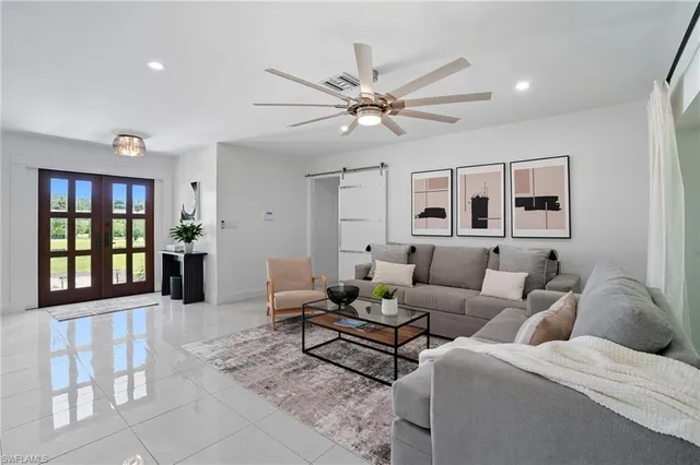 a living room with furniture and a window