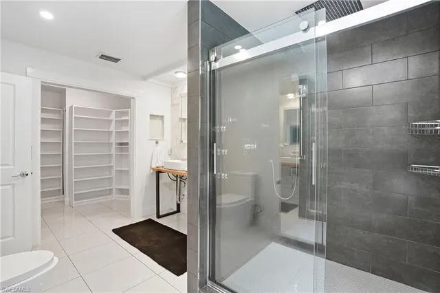 a bathroom with a shower and a toilet