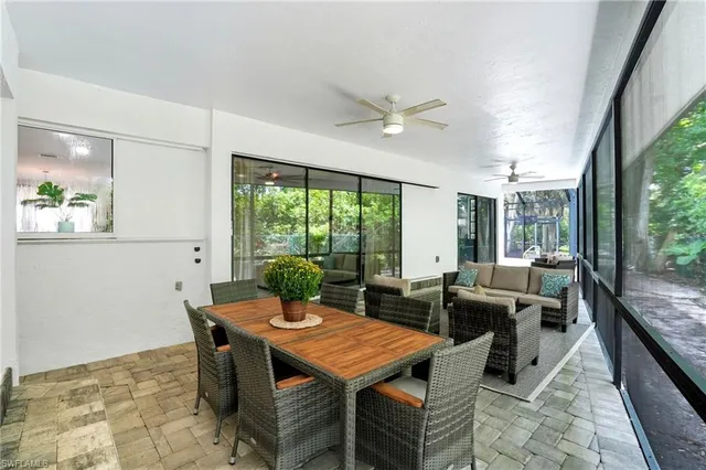 a view of a dining room with furniture window and outside view