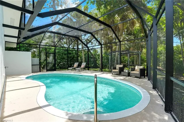 a view of a swimming pool with a patio
