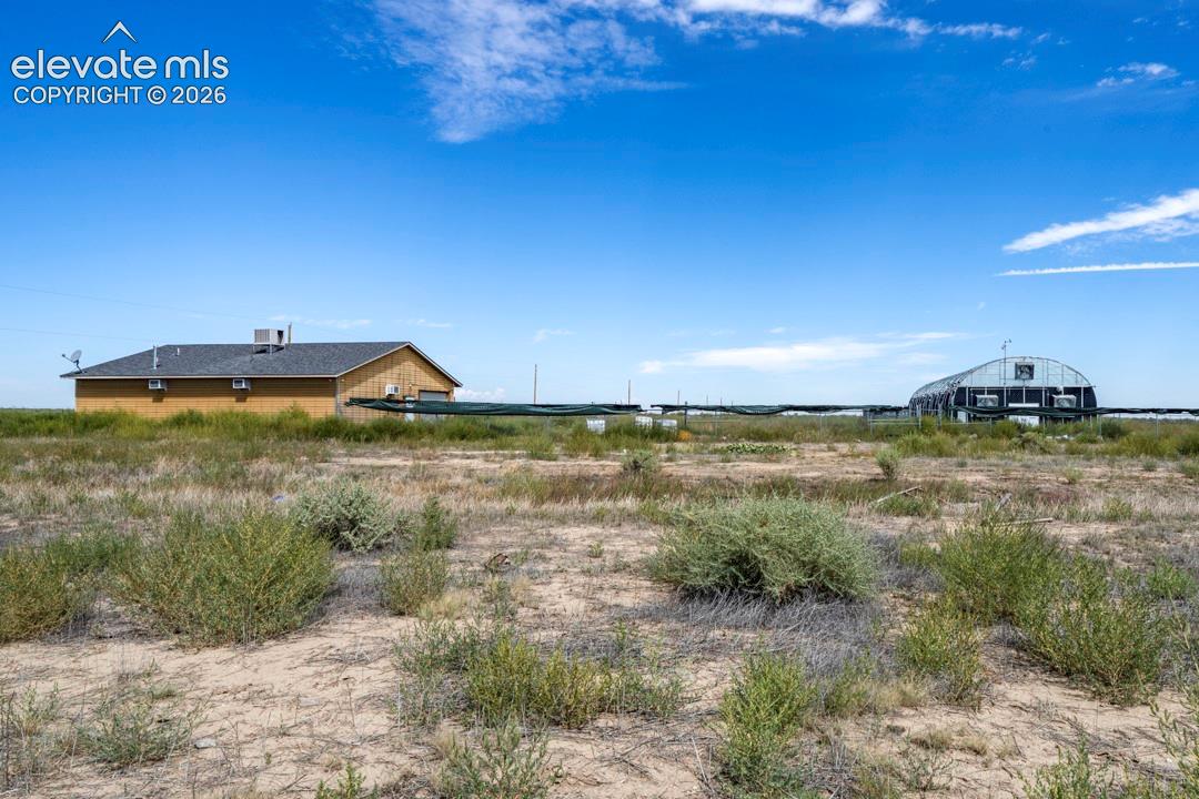 41751 Harbour Road Avondale, CO 81022 - Photo 23 of 41 Shop w/ Greenhouse, fencing, AC units, bay door, front and back door entrance