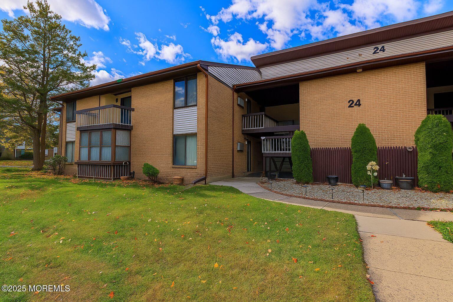 24 Meadow Green Circle, Unit A Manalapan, NJ 07726 - Photo 1 of 24 a view of a house with backyard