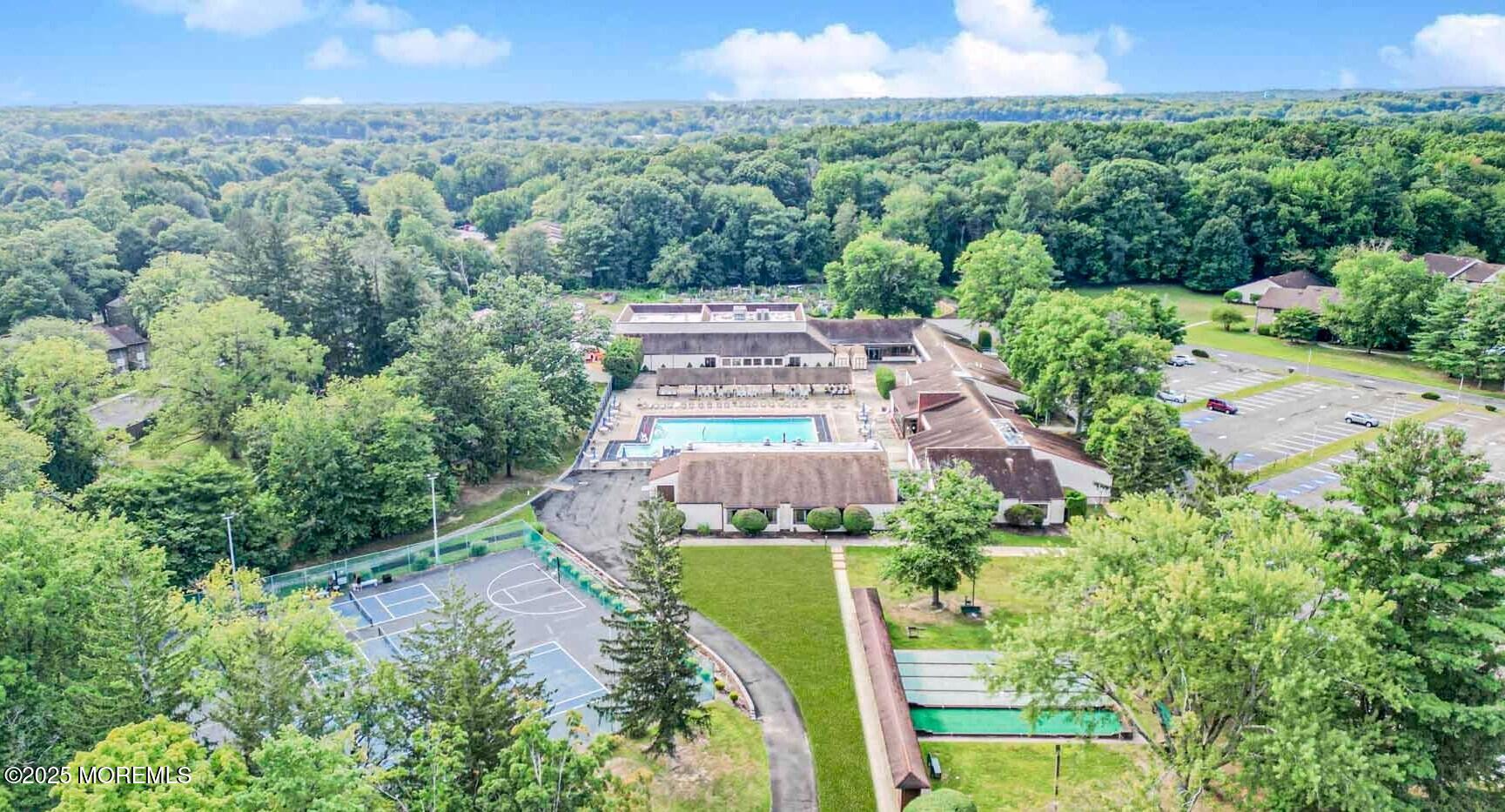 24 Meadow Green Circle, Unit A Manalapan, NJ 07726 - Photo 17 of 24 an aerial view of residential houses with outdoor space and trees all around