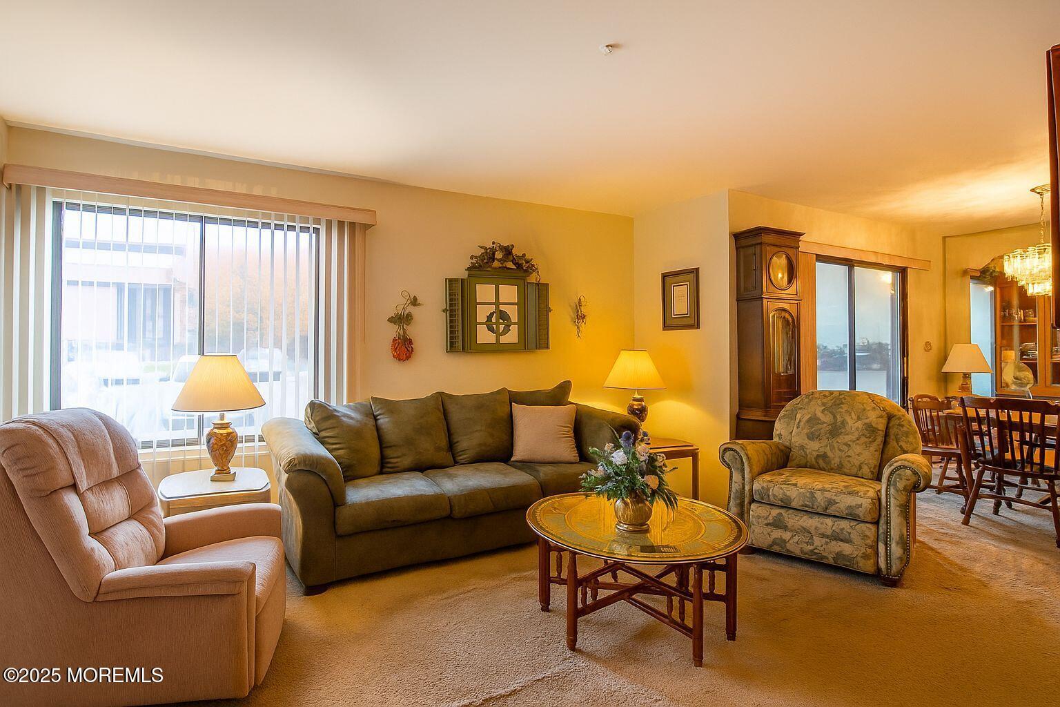 24 Meadow Green Circle, Unit A Manalapan, NJ 07726 - Photo 8 of 24 a living room with furniture and a large window