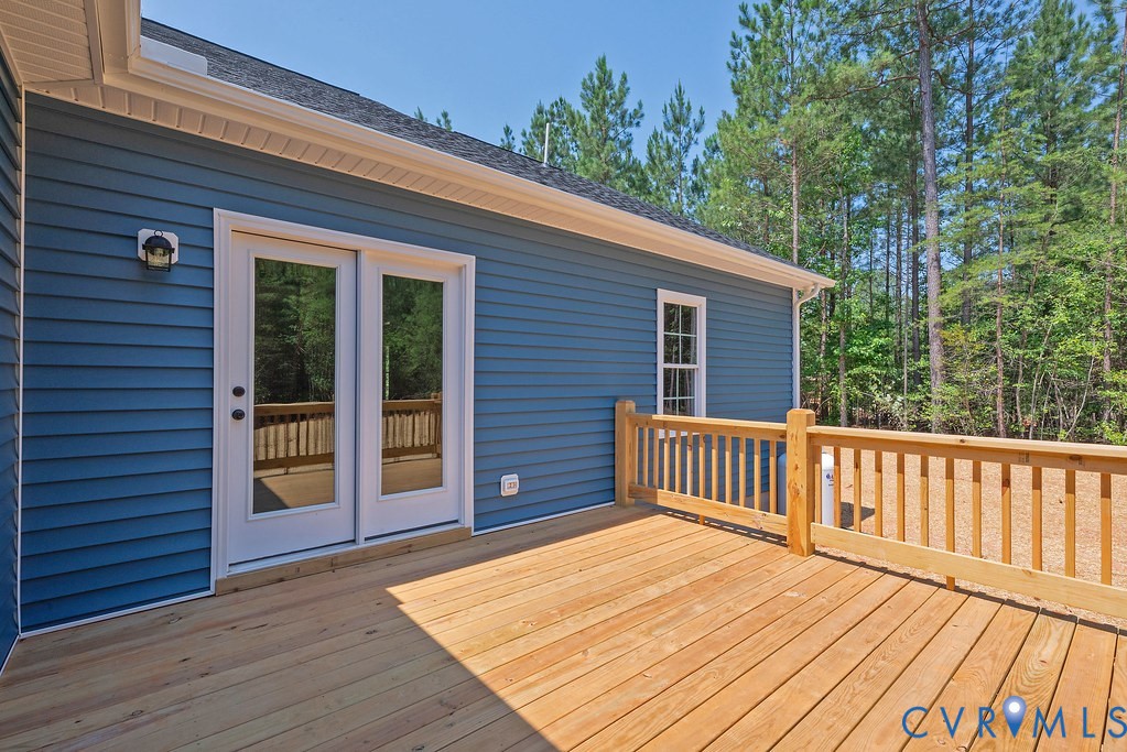 2223 Ridge Road Arvonia, VA 23004 - Photo 38 of 45 Expansive wood-finish deck with a wood railing sys