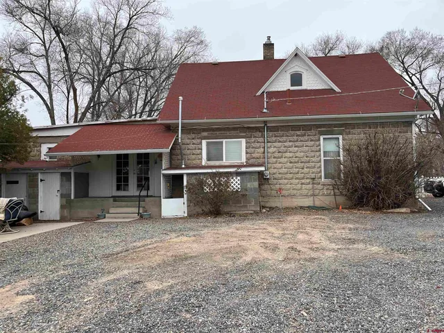 a front view of a house with yard