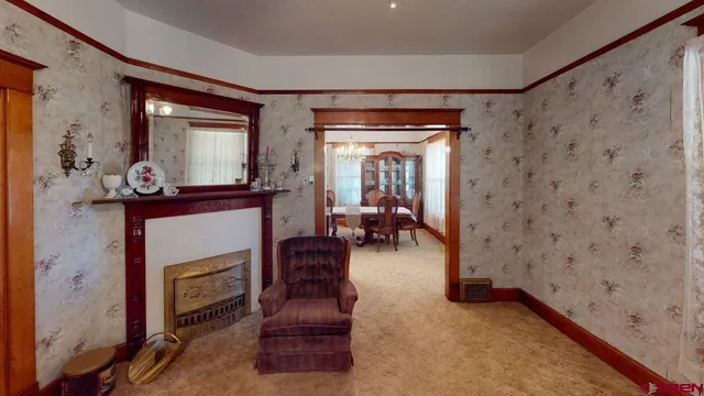 a living room with furniture and a fireplace