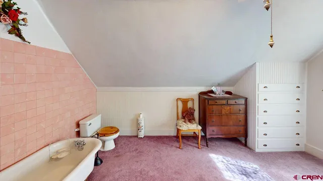 a view of a bedroom with baby bed