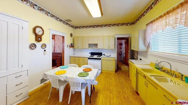 a dining room filled counter top space furniture and kitchen view