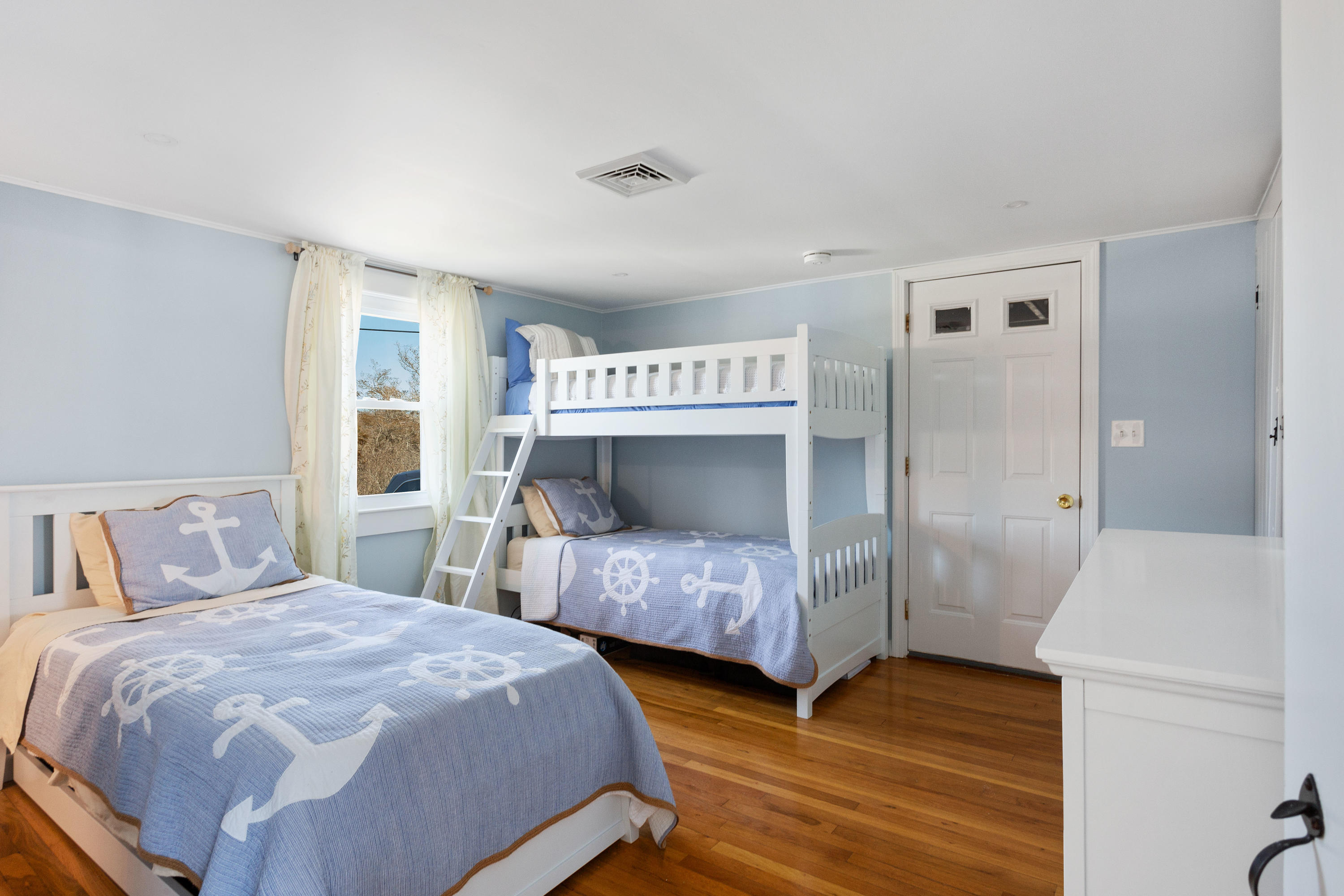 115 Seagull Road Chatham, MA 02633 - Photo 12 of 29 a bedroom with two beds and a dresser