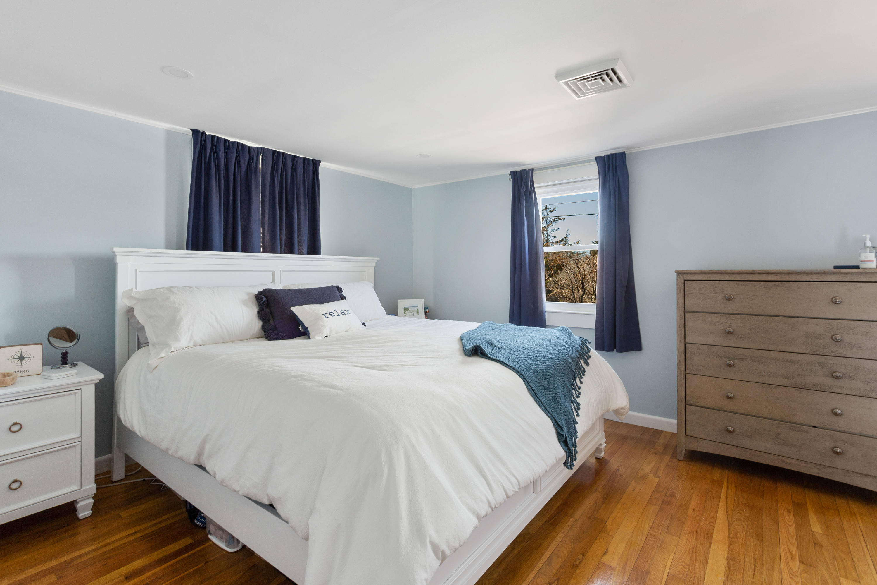 115 Seagull Road Chatham, MA 02633 - Photo 17 of 29 a bedroom with a bed and a dresser