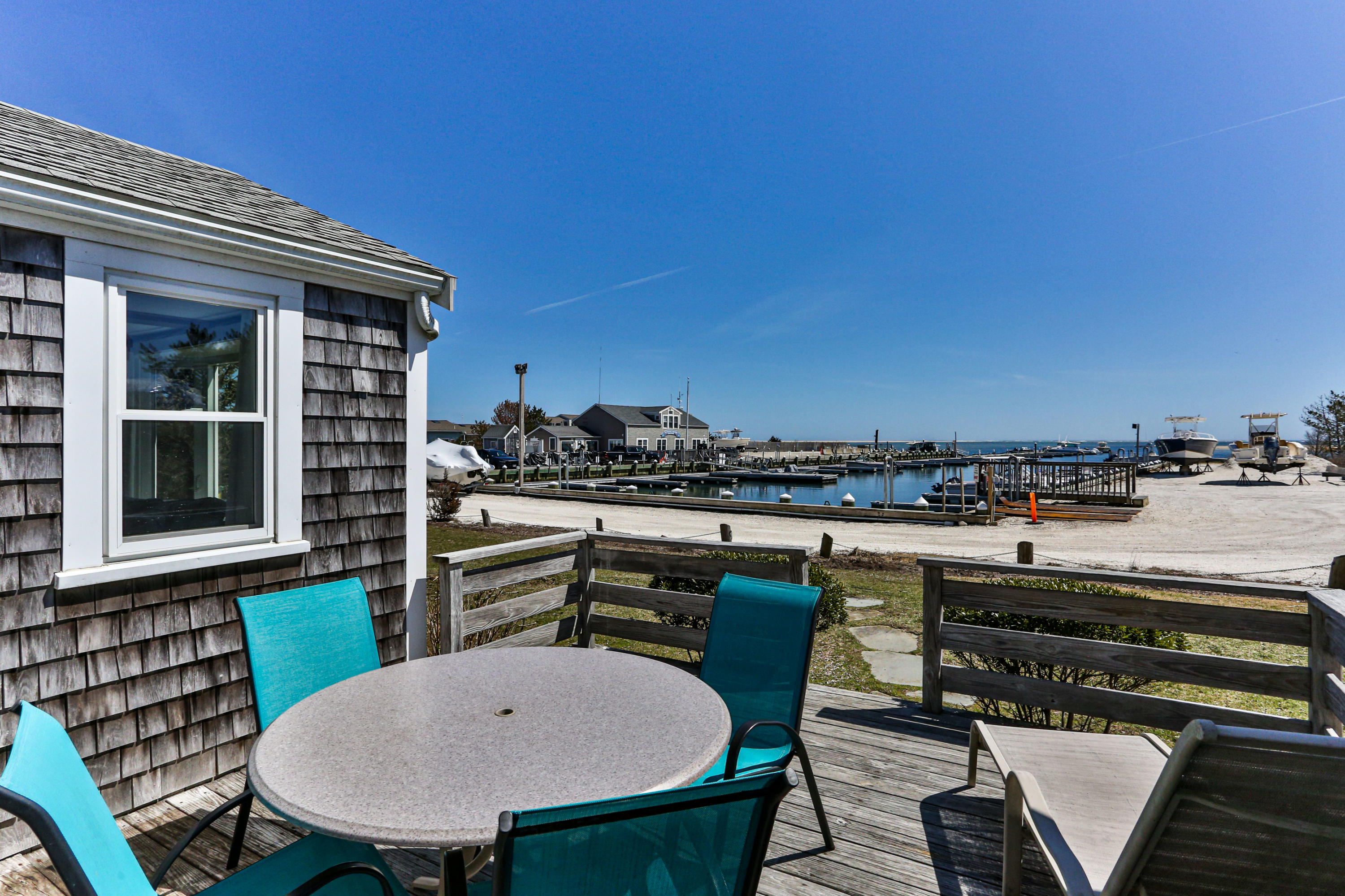 115 Seagull Road Chatham, MA 02633 - Photo 22 of 29 a view of a chairs and table in the terrace