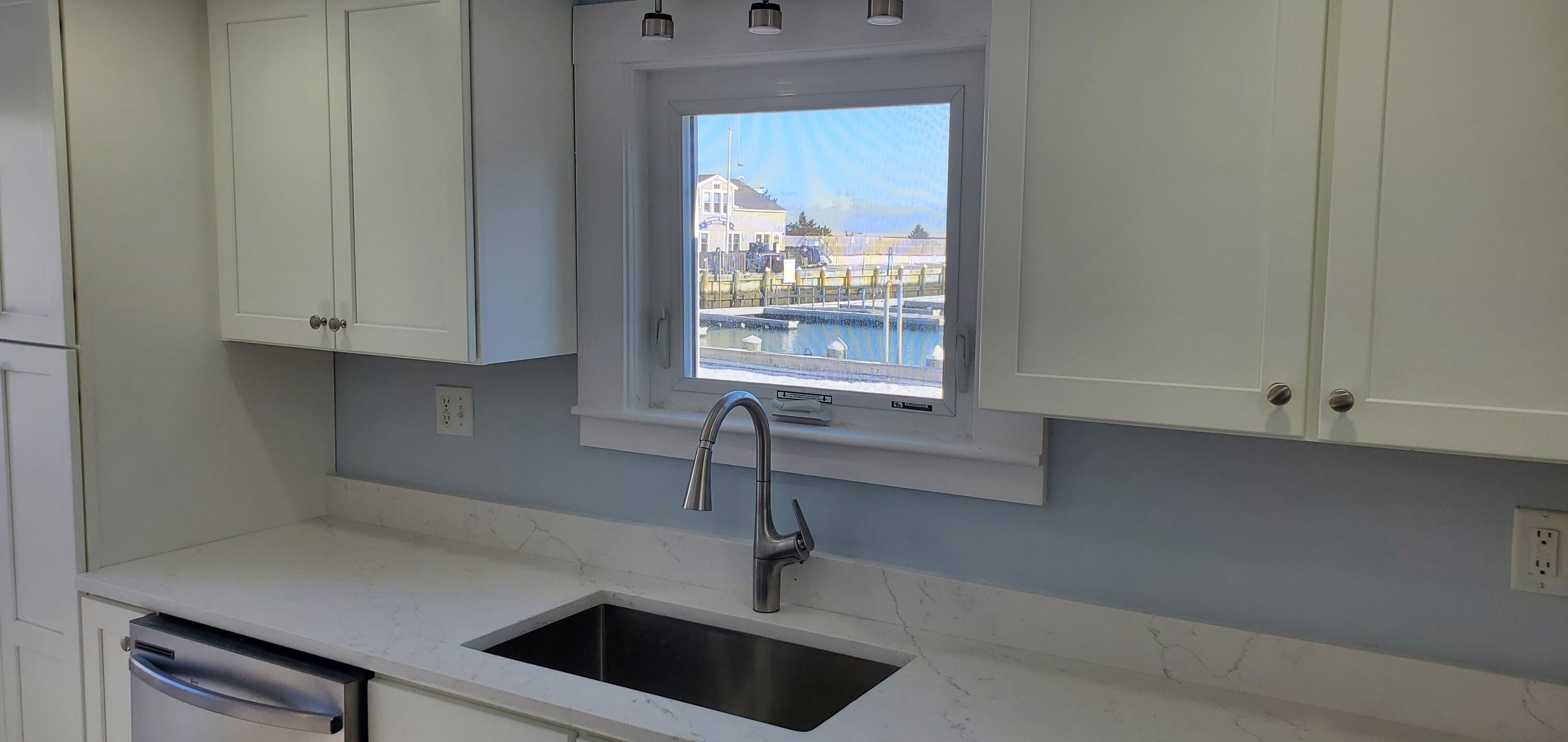 115 Seagull Road Chatham, MA 02633 - Photo 28 of 29 a kitchen with a sink and a window