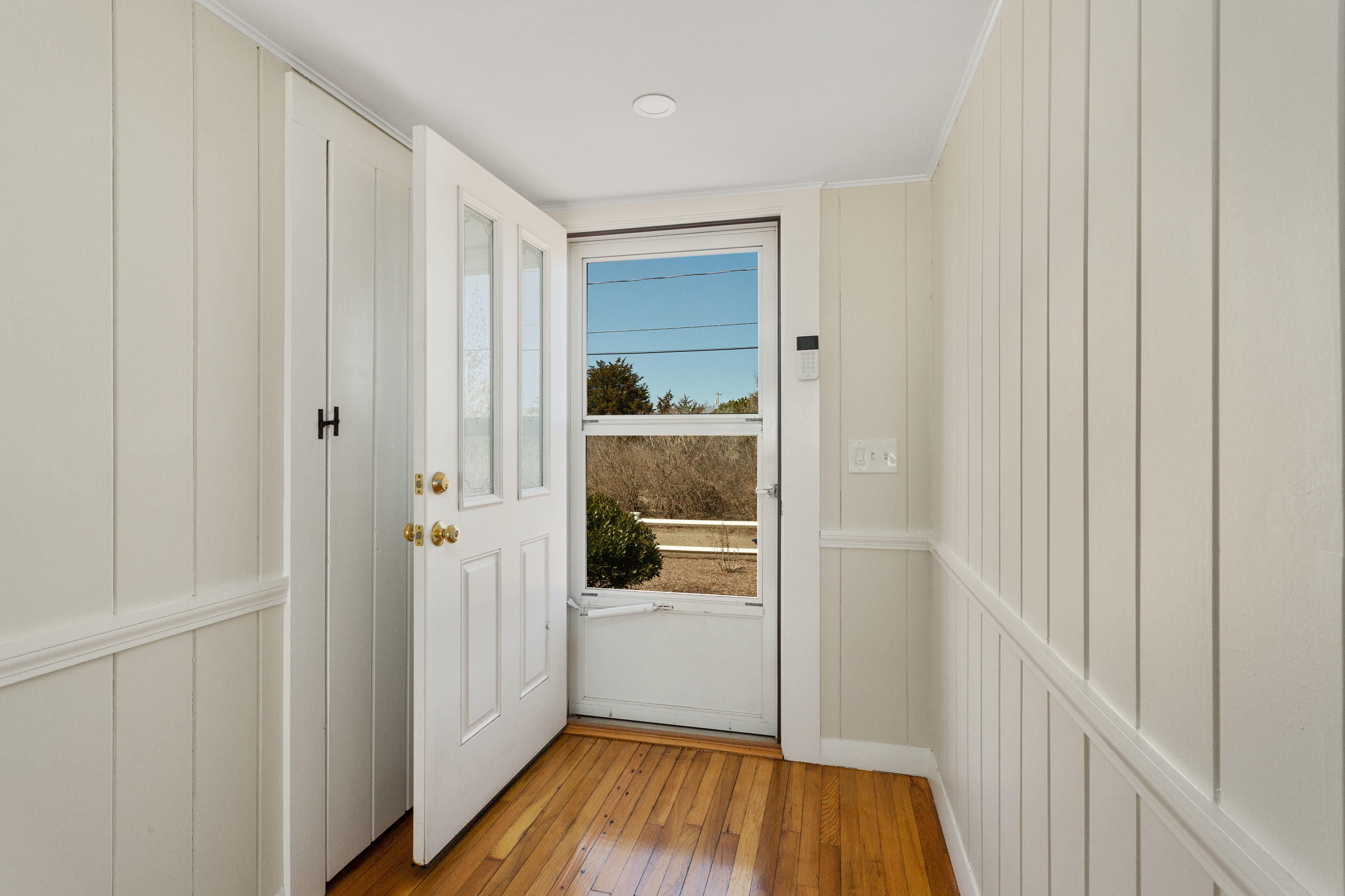 115 Seagull Road Chatham, MA 02633 - Photo 6 of 29 a view of a hallway with wooden floor and closet area