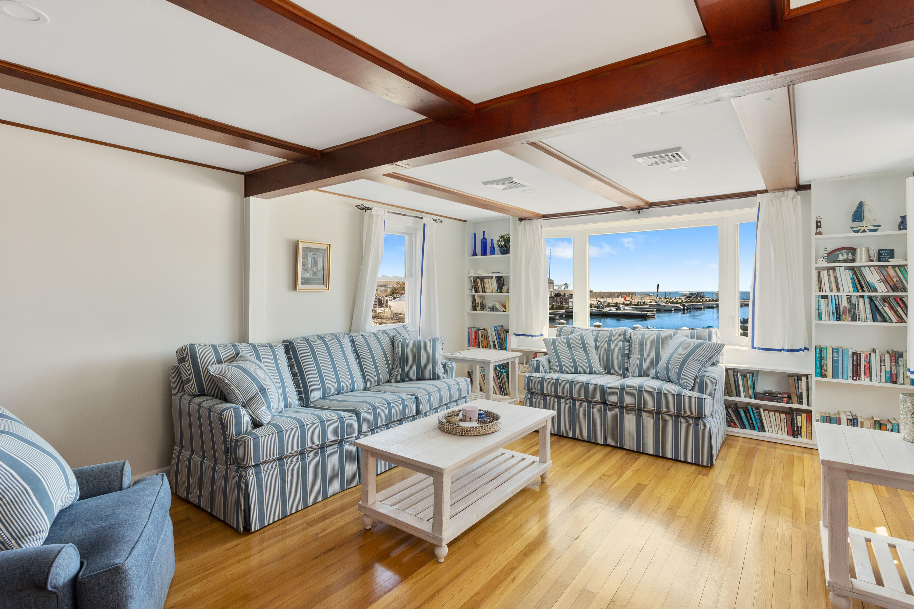 115 Seagull Road Chatham, MA 02633 - Photo 9 of 29 a living room with furniture and a wooden floor