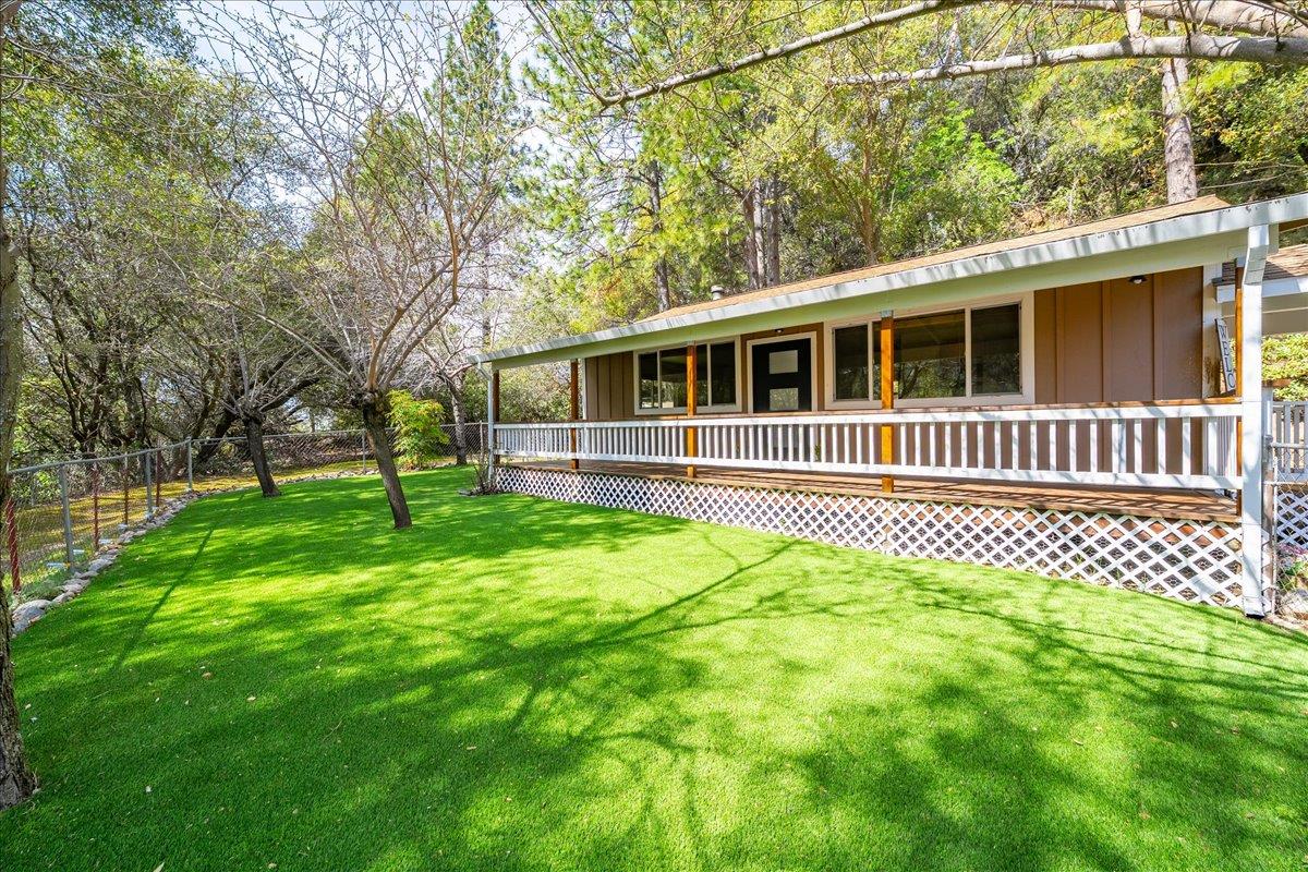 1302 Nicks Lane Placerville, CA 95667 - Photo 11 of 51 a front view of a house with a garden
