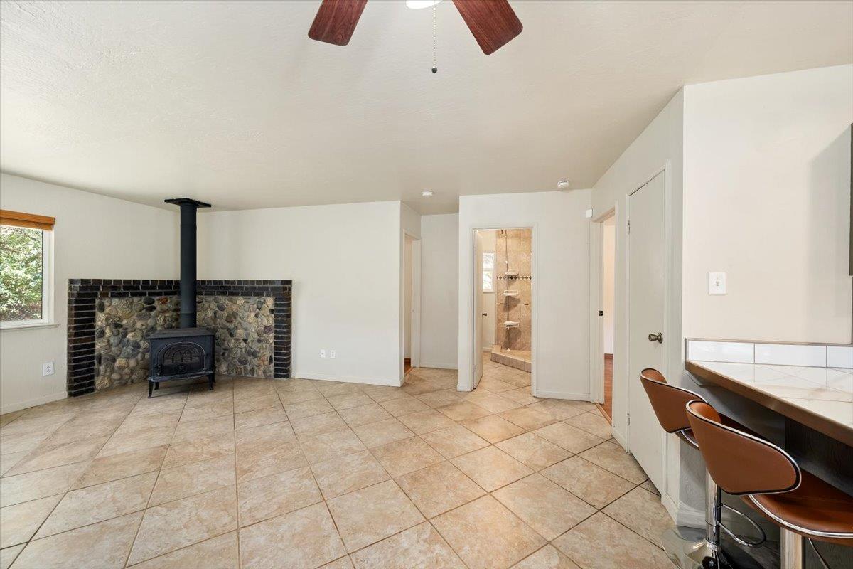 1302 Nicks Lane Placerville, CA 95667 - Photo 16 of 51 a spacious bedroom with a bed and a chandelier