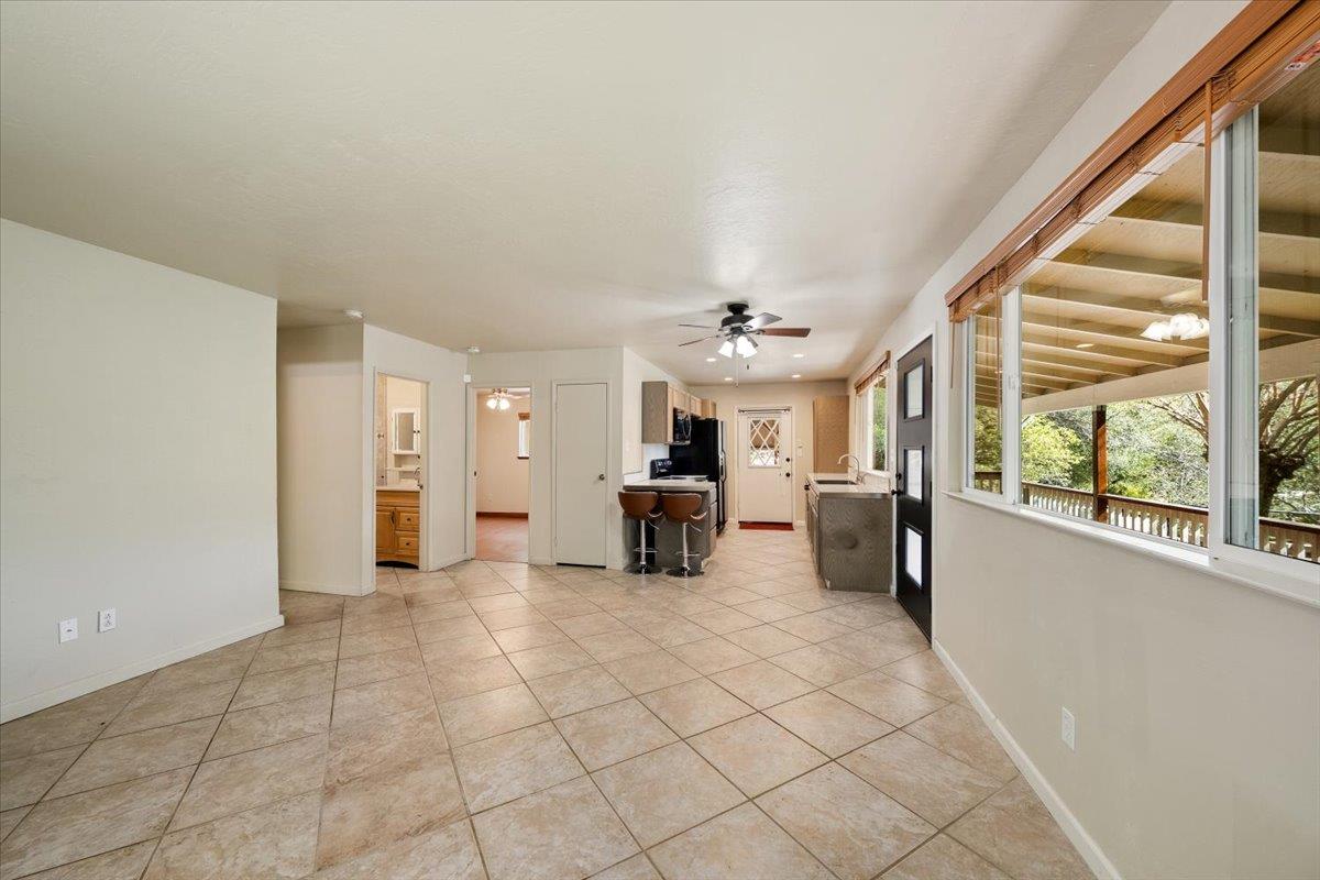 1302 Nicks Lane Placerville, CA 95667 - Photo 21 of 51 a large room with chandelier fan and windows