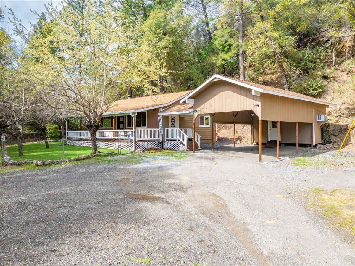 1302 Nicks Lane Placerville, CA 95667 - Photo 3 of 51 a front view of a house with a garden