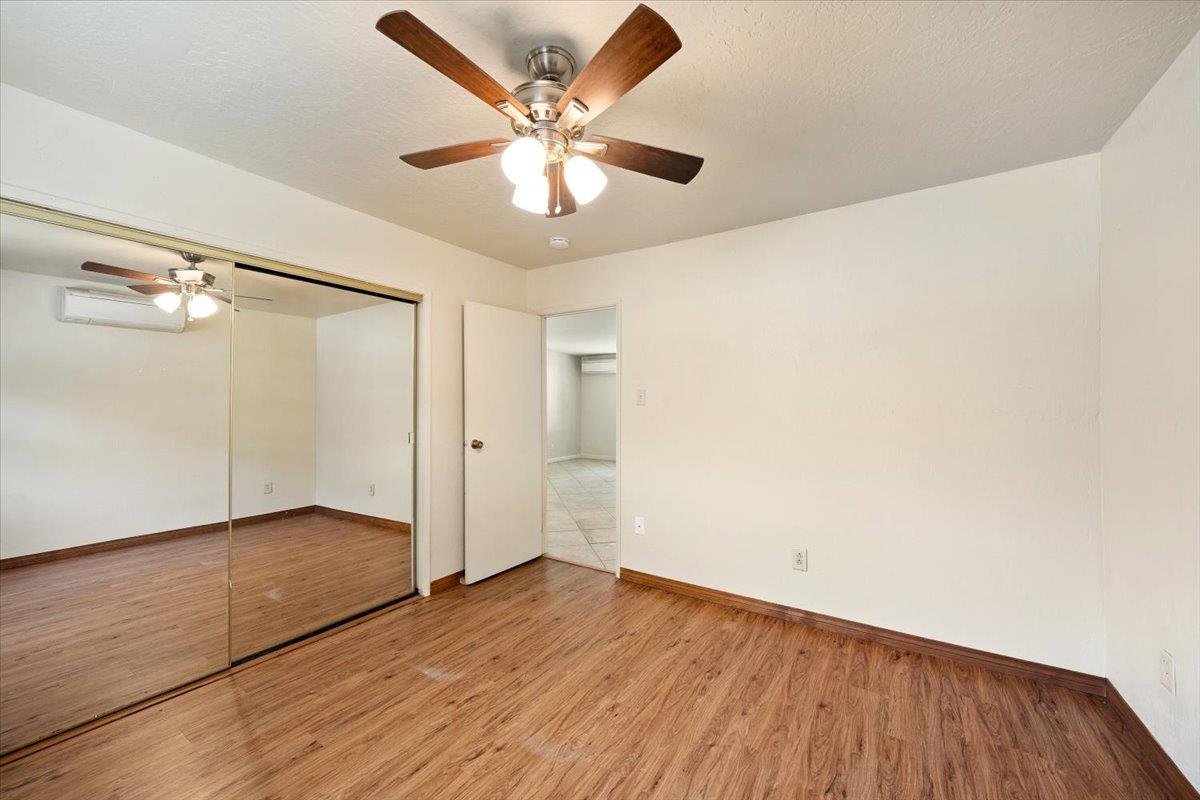 1302 Nicks Lane Placerville, CA 95667 - Photo 31 of 51 an empty room with wooden floor and windows