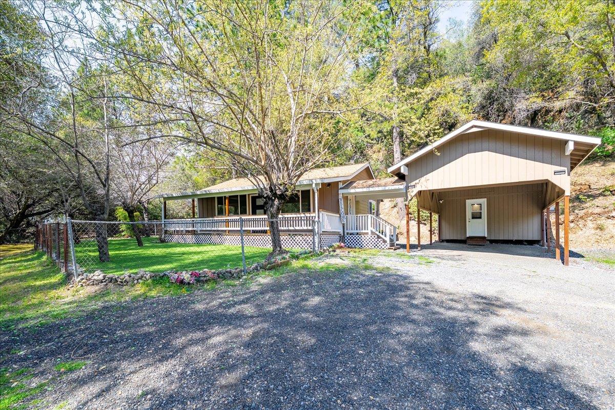 1302 Nicks Lane Placerville, CA 95667 - Photo 38 of 51 a front view of a house with a yard and trees