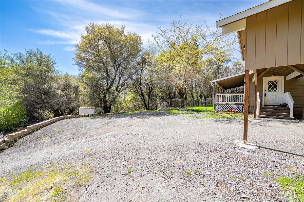 1302 Nicks Lane Placerville, CA 95667 - Photo 40 of 51 a backyard of a house with table and chairs