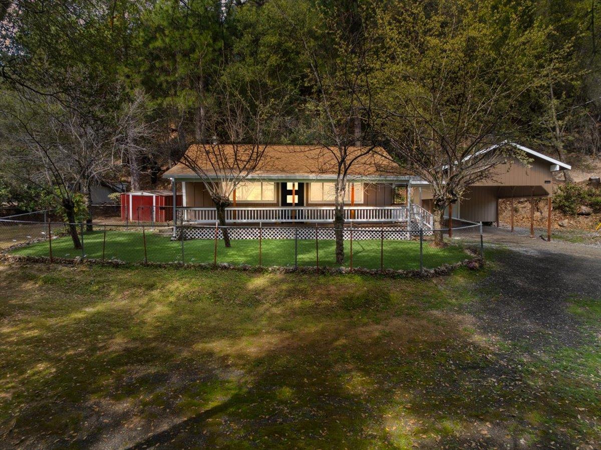 1302 Nicks Lane Placerville, CA 95667 - Photo 4 of 51 a front view of a house with a yard